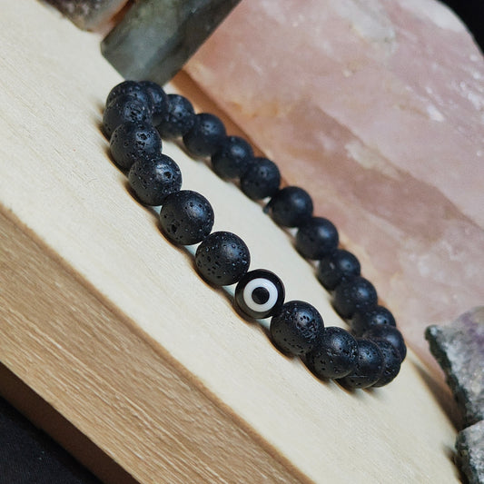 Pulsera piedra lava y ojo turco negro